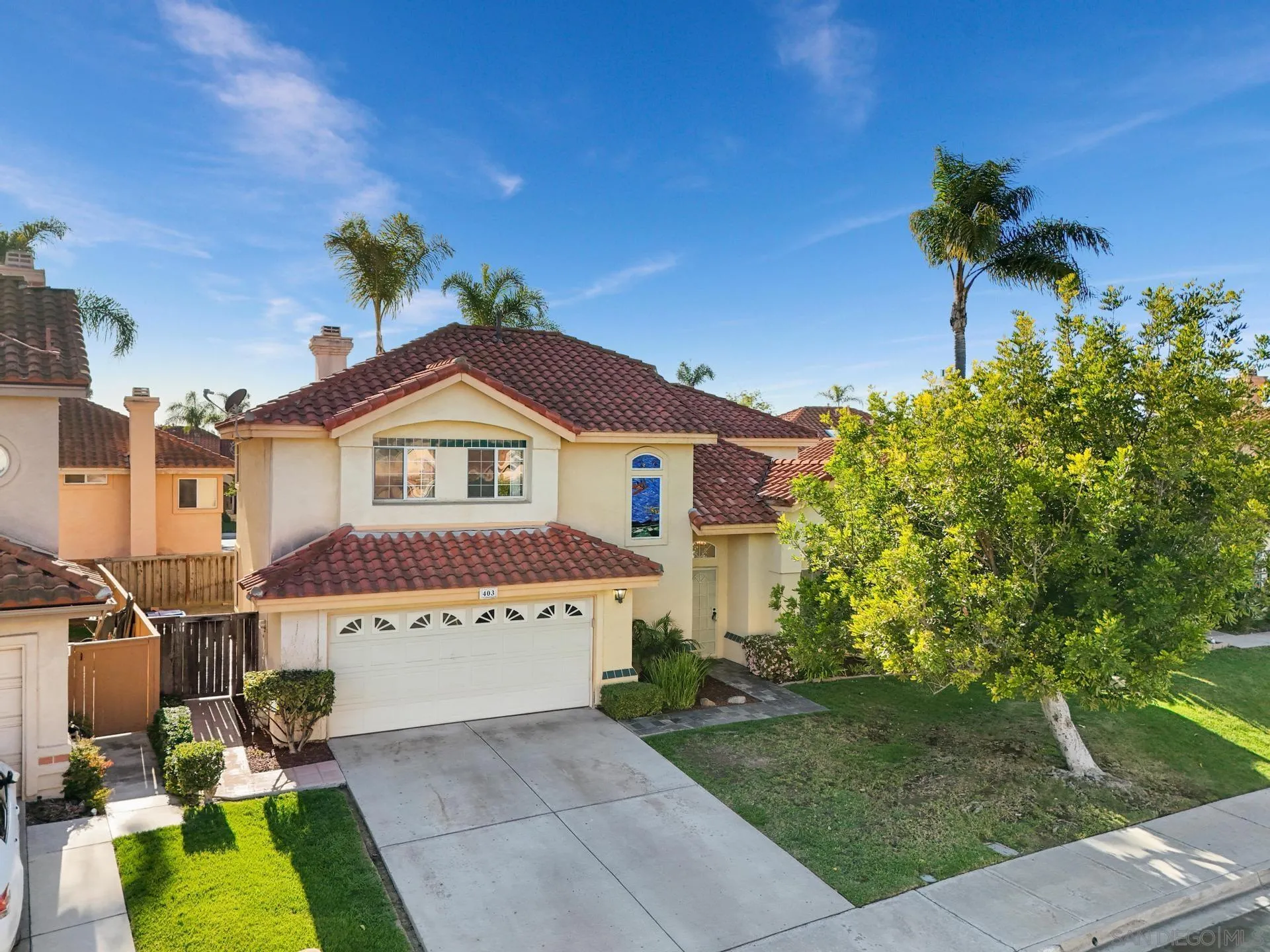 403 Calle Corazon Oceanside, CA 92057 - Photo 39 of 40 a front view of a house with a garden