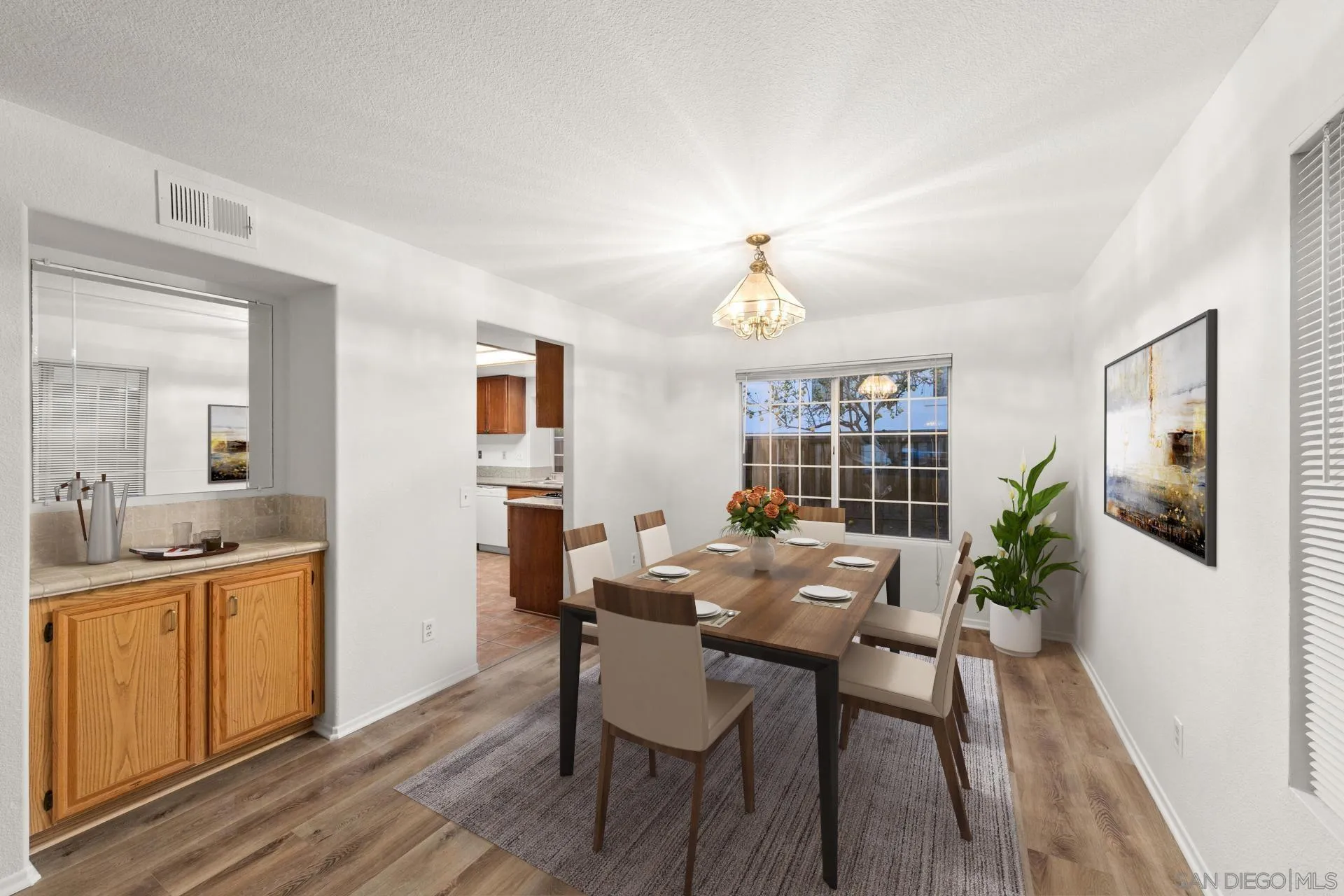 403 Calle Corazon Oceanside, CA 92057 - Photo 5 of 40 a view of a dining room with furniture window and wooden floor