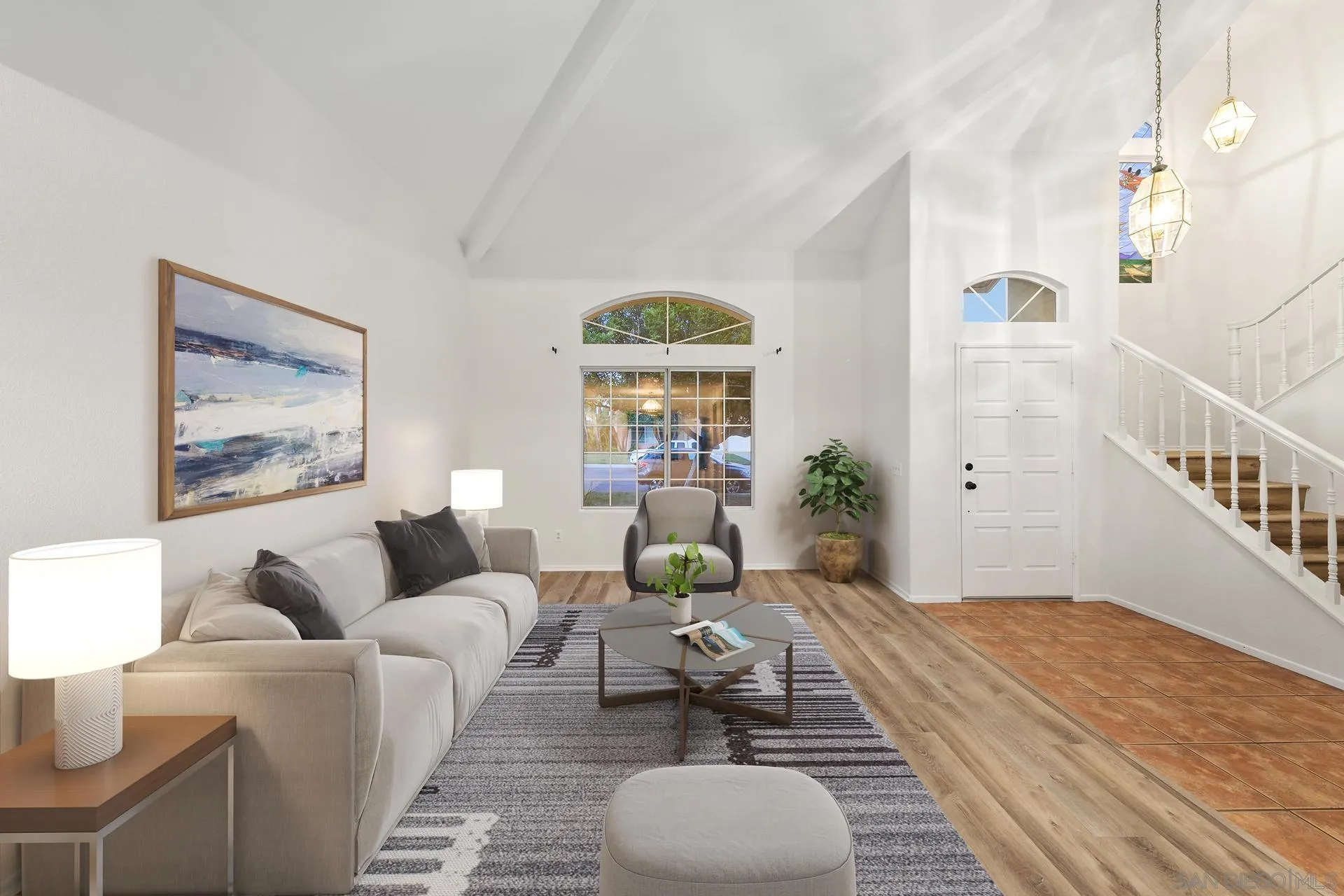 403 Calle Corazon Oceanside, CA 92057 - Photo 6 of 40 a living room with furniture a table and paintings on the wall