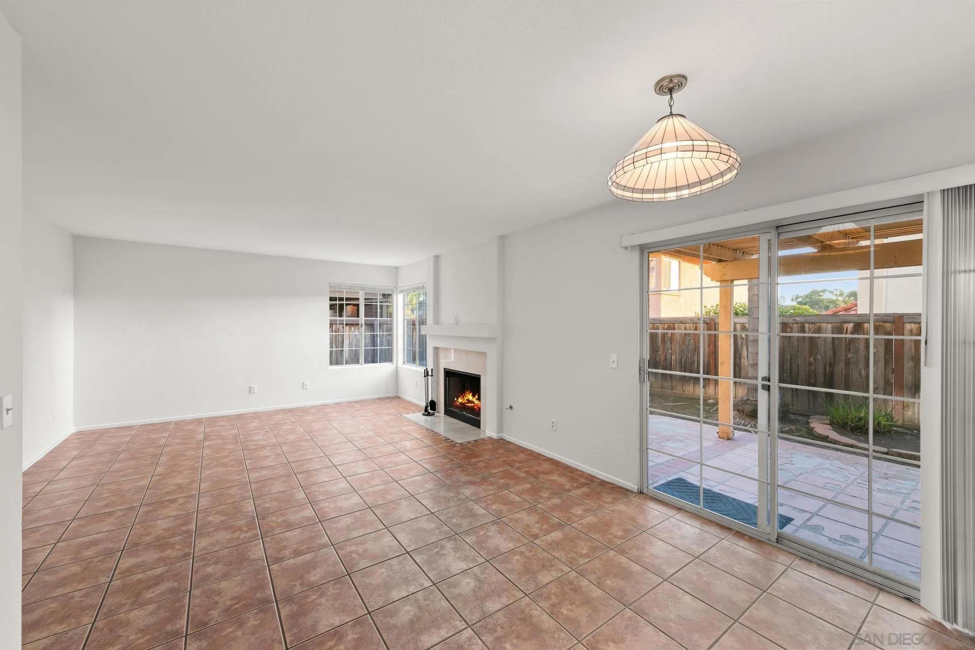 403 Calle Corazon Oceanside, CA 92057 - Photo 7 of 40 a view of empty room with floor to ceiling window and table