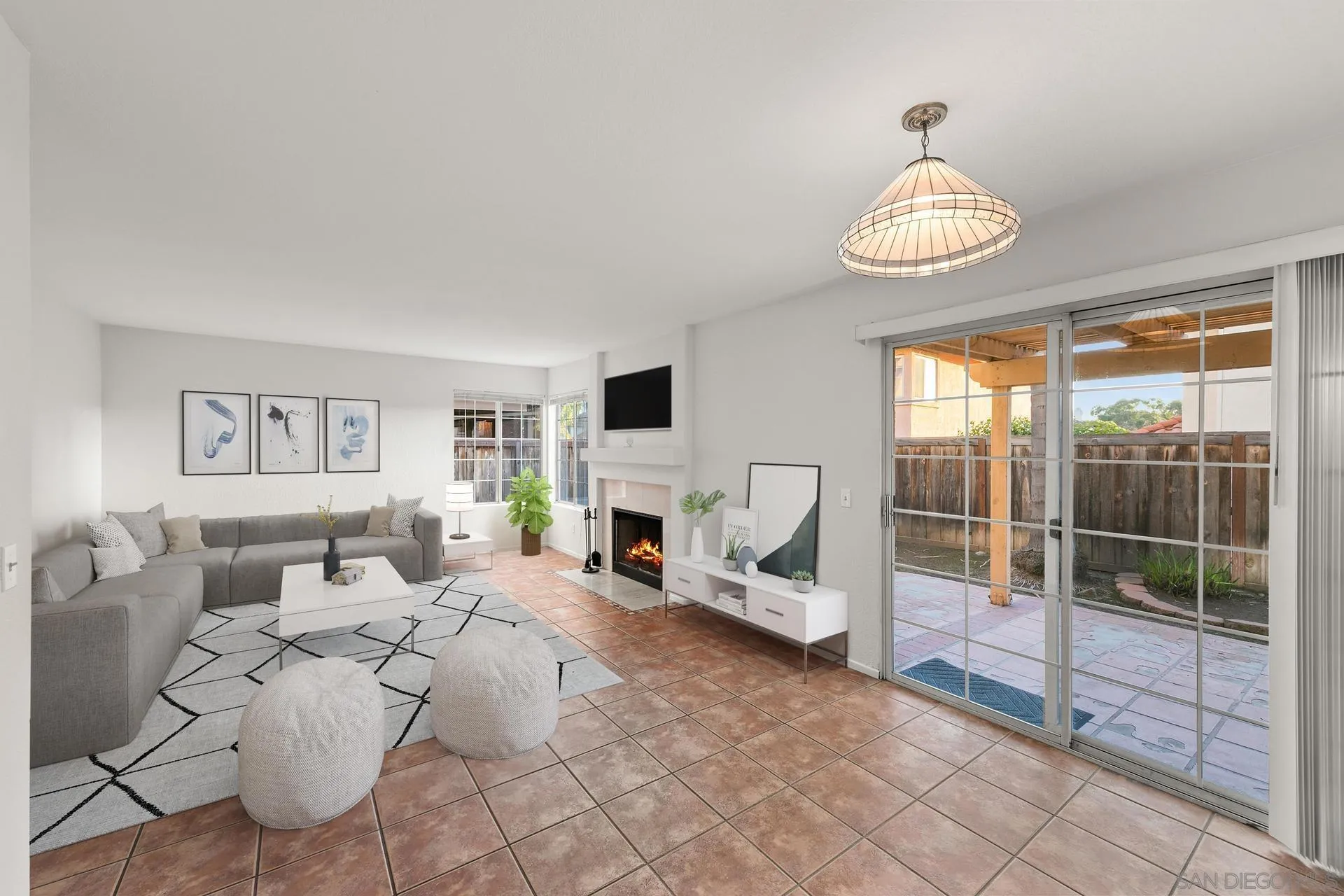 403 Calle Corazon Oceanside, CA 92057 - Photo 8 of 40 a living room with furniture a fireplace and a flat screen tv