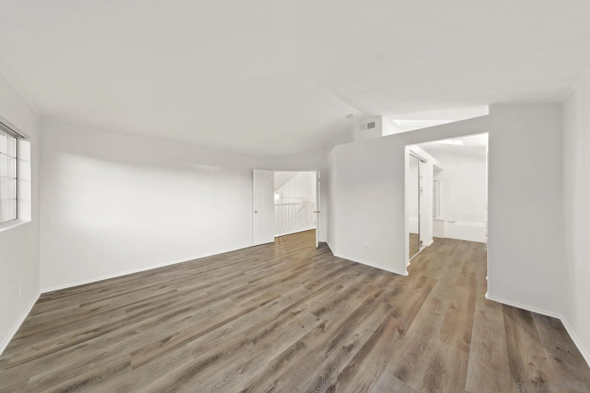 403 Calle Corazon Oceanside, CA 92057 - Photo 9 of 40 a view of empty room with wooden floor and fan