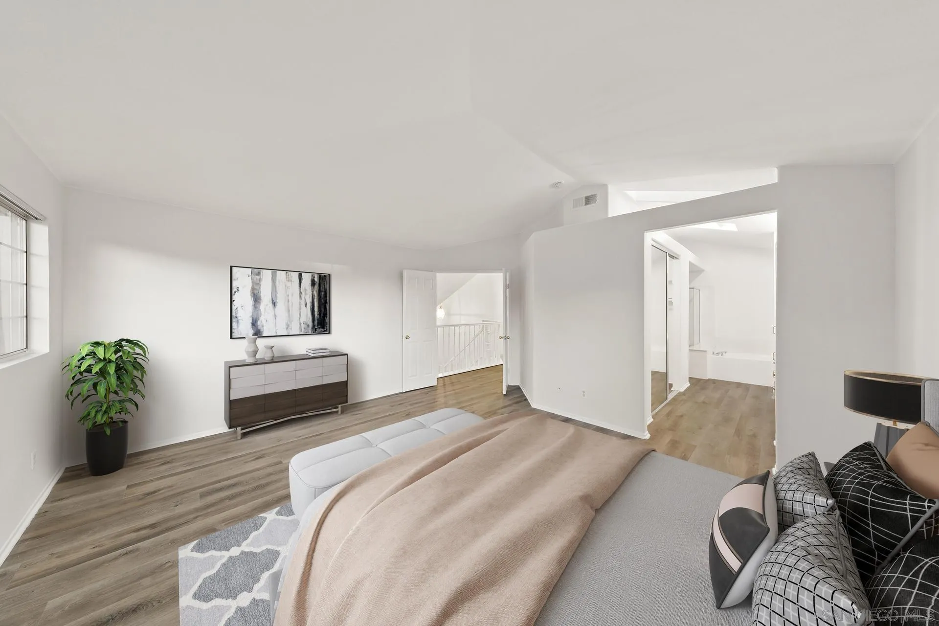 403 Calle Corazon Oceanside, CA 92057 - Photo 10 of 40 a bedroom with a bed and a couch