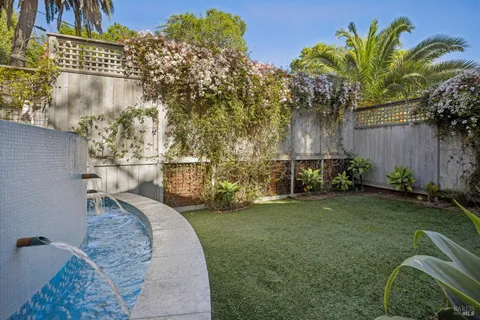 a garden view with a fountain