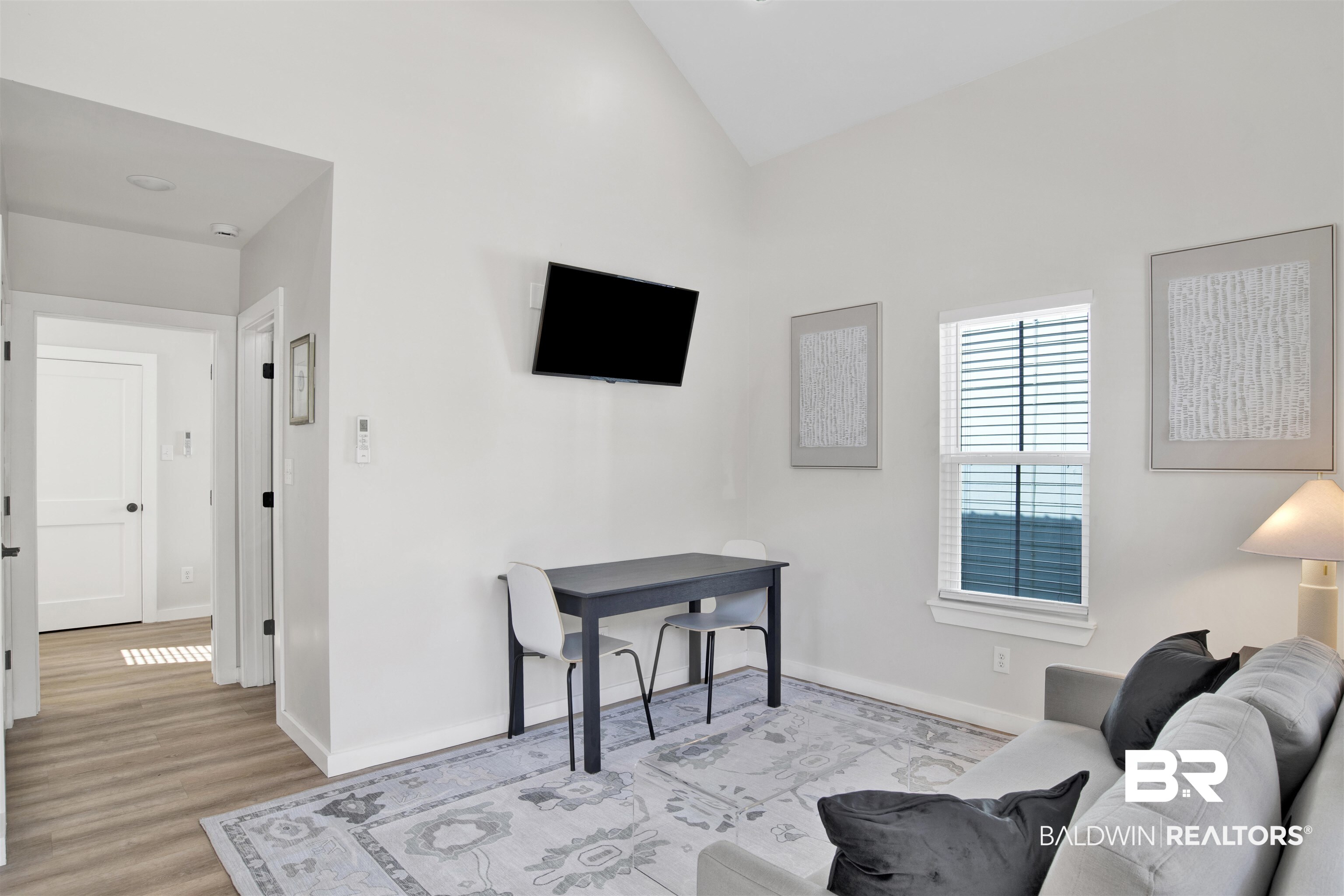 551 Congress Street Mobile, AL 36603 - Photo 7 of 19 Living room featuring light wood finished floors and lofted ceiling