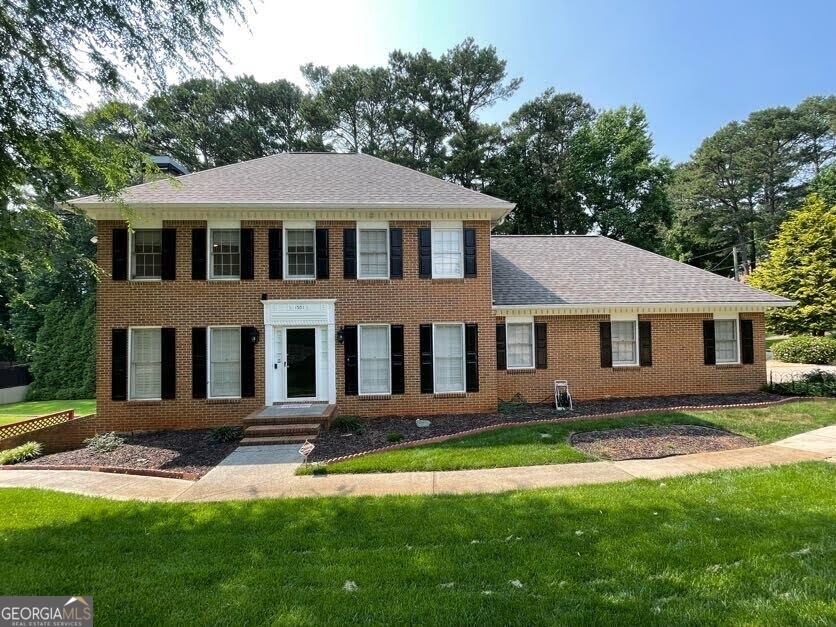 a front view of a house with a yard