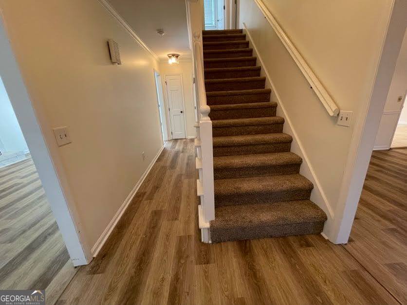 1502 Eryn Circle Suwanee, GA 30024 - Photo 2 of 57 a view of entryway and gallery with wooden floor