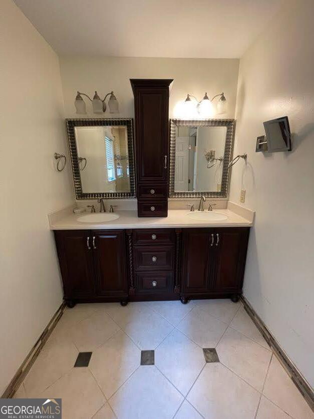 1502 Eryn Circle Suwanee, GA 30024 - Photo 21 of 57 a bathroom with a sink vanity and mirror