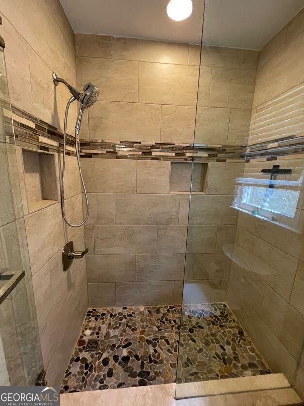 1502 Eryn Circle Suwanee, GA 30024 - Photo 23 of 57 a bathroom with a shower