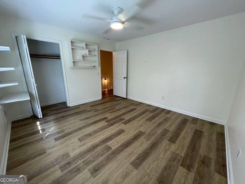 1502 Eryn Circle Suwanee, GA 30024 - Photo 27 of 57 a view of empty room with wooden floor