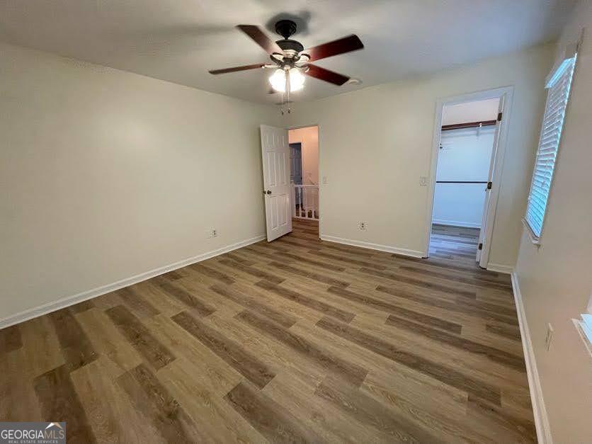 1502 Eryn Circle Suwanee, GA 30024 - Photo 29 of 57 wooden floor in an empty room with a window