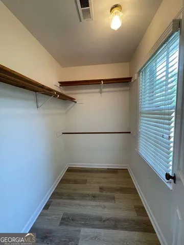 a bedroom with furniture and a chandelier