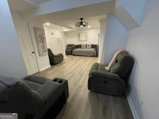 a kitchen with stainless steel appliances a refrigerator a sink a stove top oven a refrigerator and cabinets