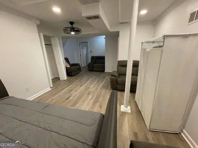 a kitchen with granite countertop white cabinets and a sink