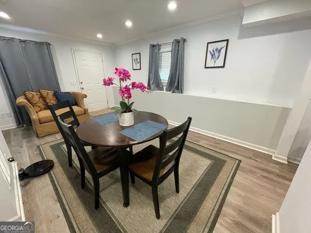 a bathroom with a sink toilet and a mirror