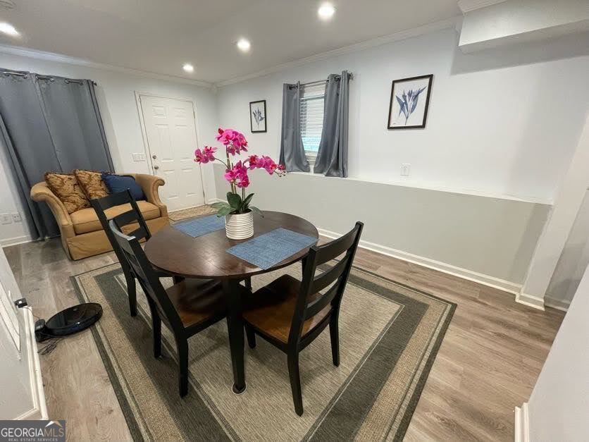 1502 Eryn Circle Suwanee, GA 30024 - Photo 40 of 57 a view of a dining room with furniture and wooden floor