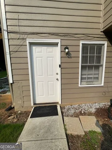 a view of a sitting area in a backyard