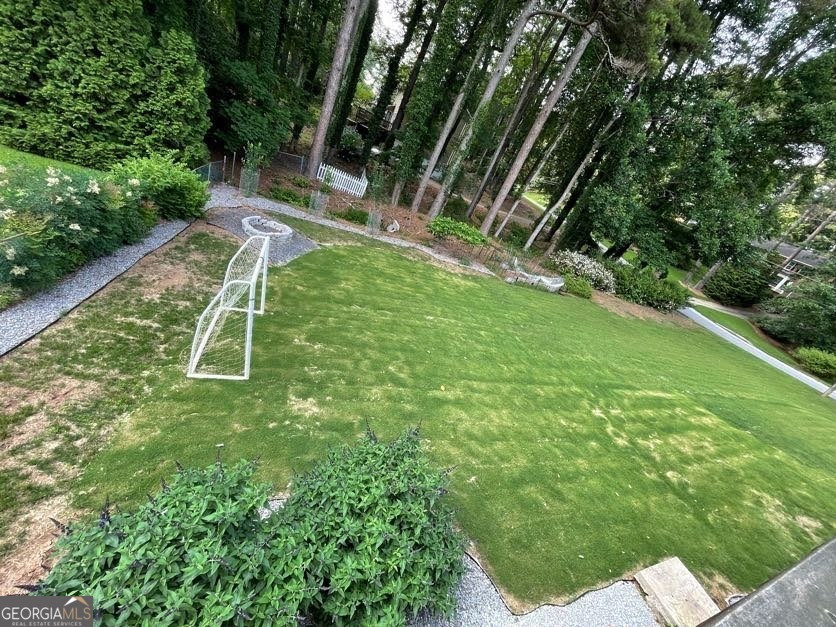 1502 Eryn Circle Suwanee, GA 30024 - Photo 53 of 57 a backyard of a house with table and chairs