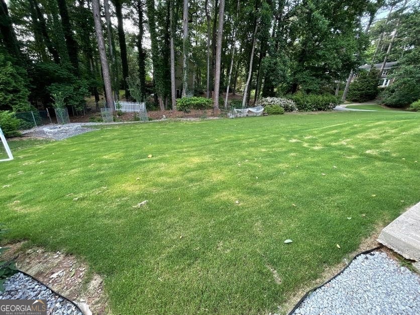 1502 Eryn Circle Suwanee, GA 30024 - Photo 55 of 57 a view of a sitting area in a backyard