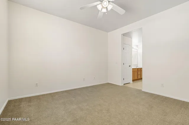 a bathroom with a double vanity sink mirror and shower