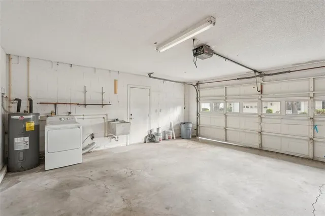 an aerial view of residential houses with outdoor space and river