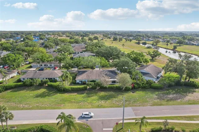 an aerial view of residential building and lake