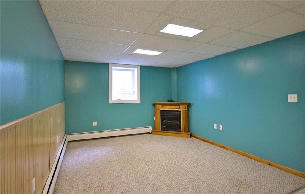 204 Main Street Springvale, ME 04083 - Photo 21 of 35 Basement Family Room with gas fireplace