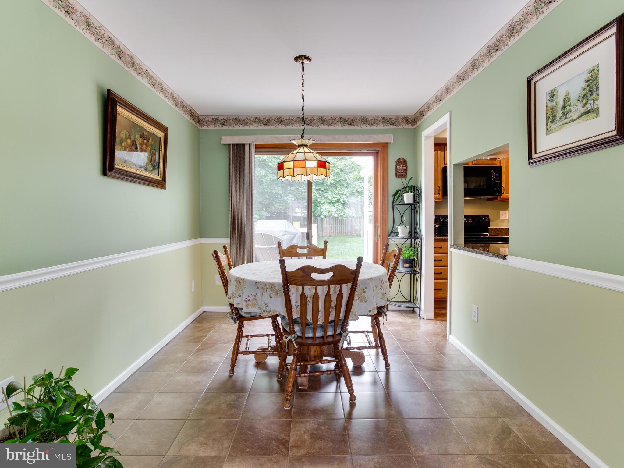 6402 Darwin Road Laurel, MD 20707 - Photo 14 of 44 Dining room:chair railing, tile floor