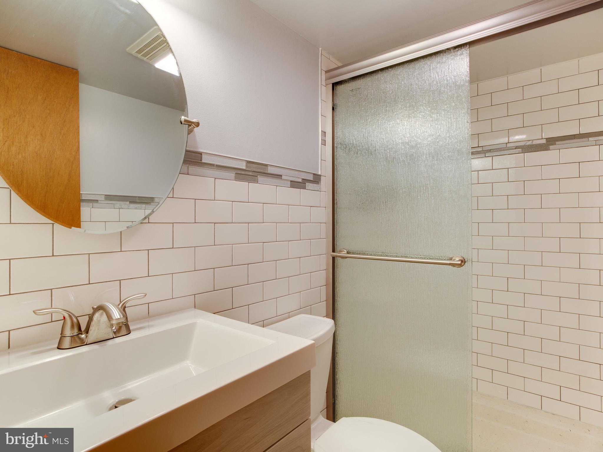 6402 Darwin Road Laurel, MD 20707 - Photo 30 of 44 Lower Level Full Bath remodeled 2019