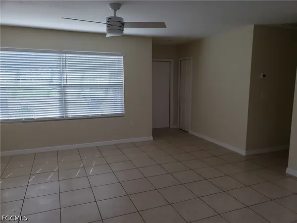 a view of an empty room and window