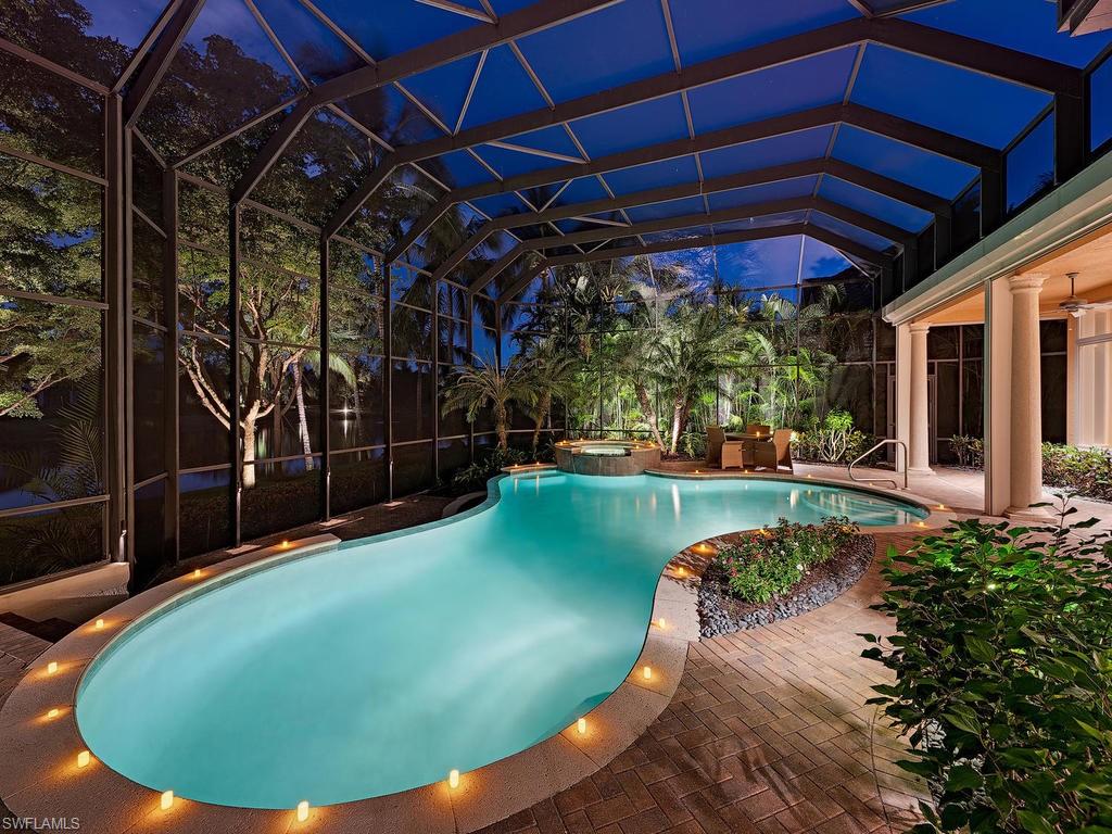 a view of a backyard with table and chairs