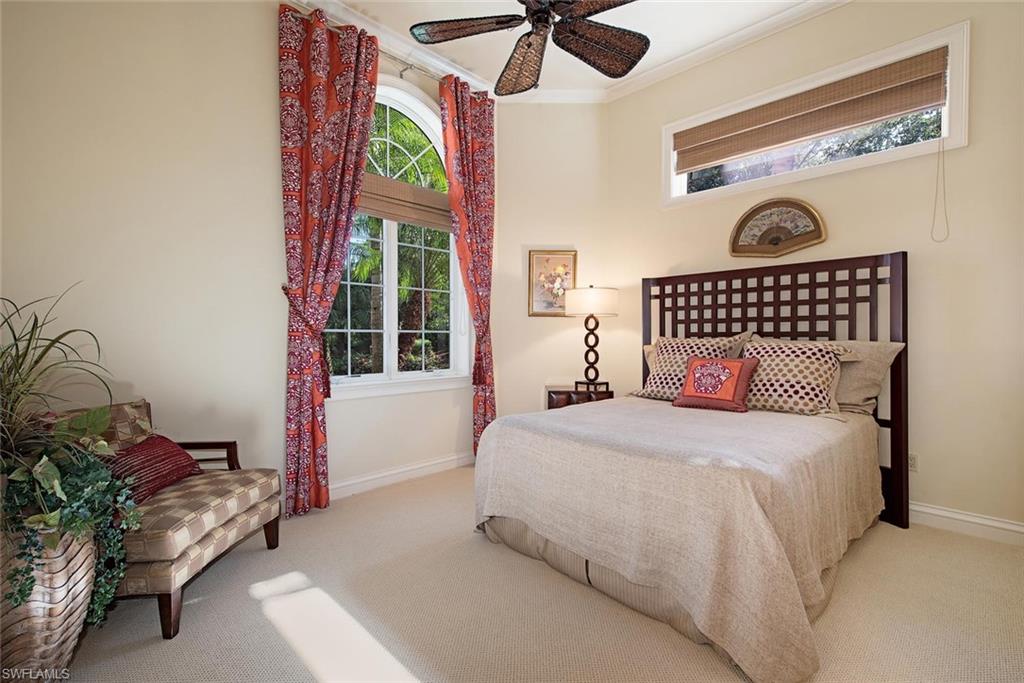 14906 Bellezza Lane Naples, FL 34110 - Photo 14 of 33 a bedroom with a bed and a window