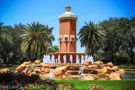 14906 Bellezza Lane Naples, FL 34110 - Photo 18 of 33 a front view of house with yard and outdoor seating
