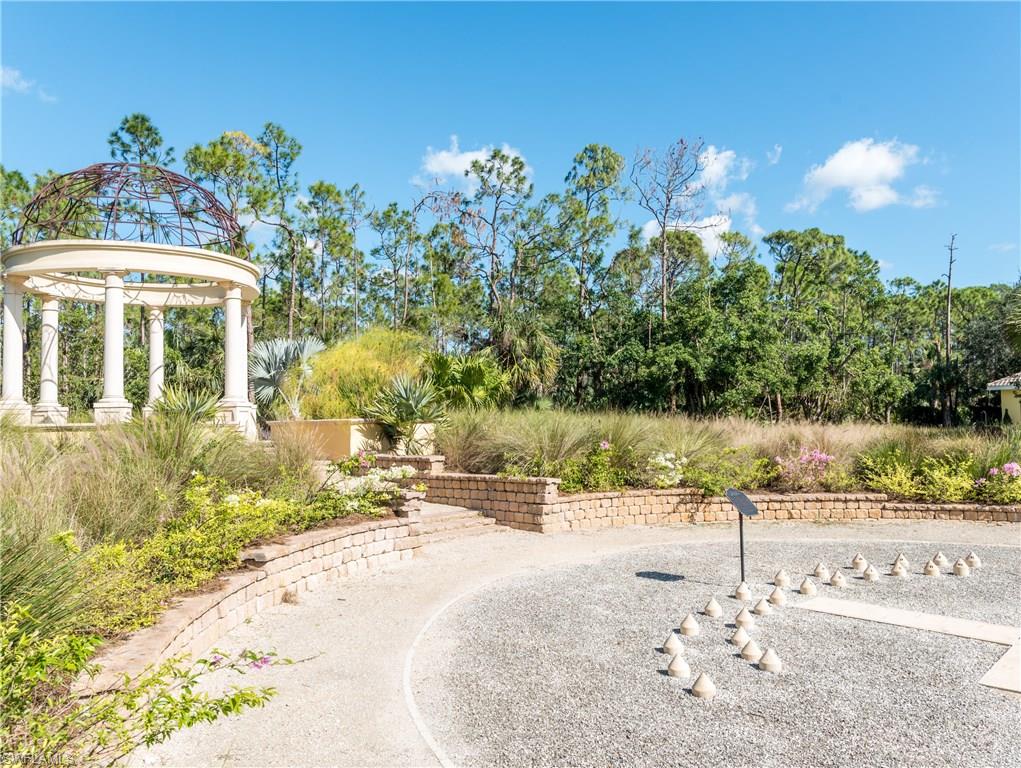 14906 Bellezza Lane Naples, FL 34110 - Photo 20 of 33 a view of a backyard of the house