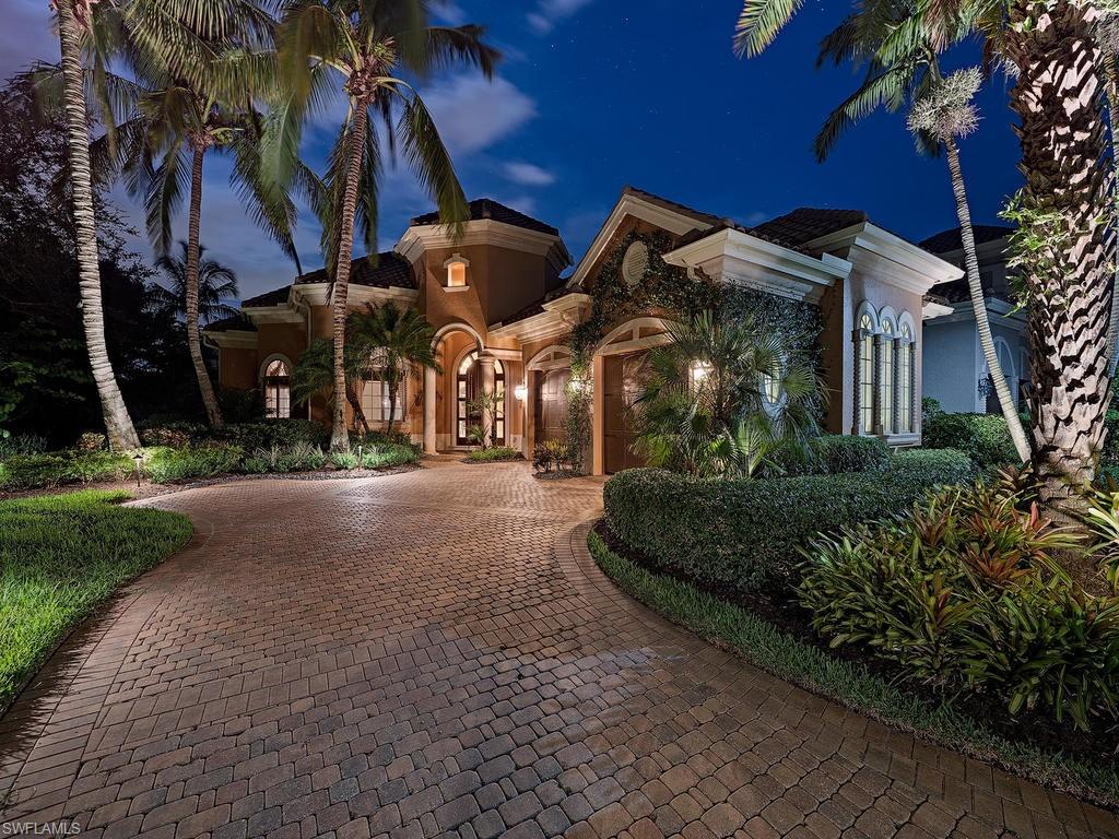 14906 Bellezza Lane Naples, FL 34110 - Photo 2 of 33 a view of a street with a building in the background