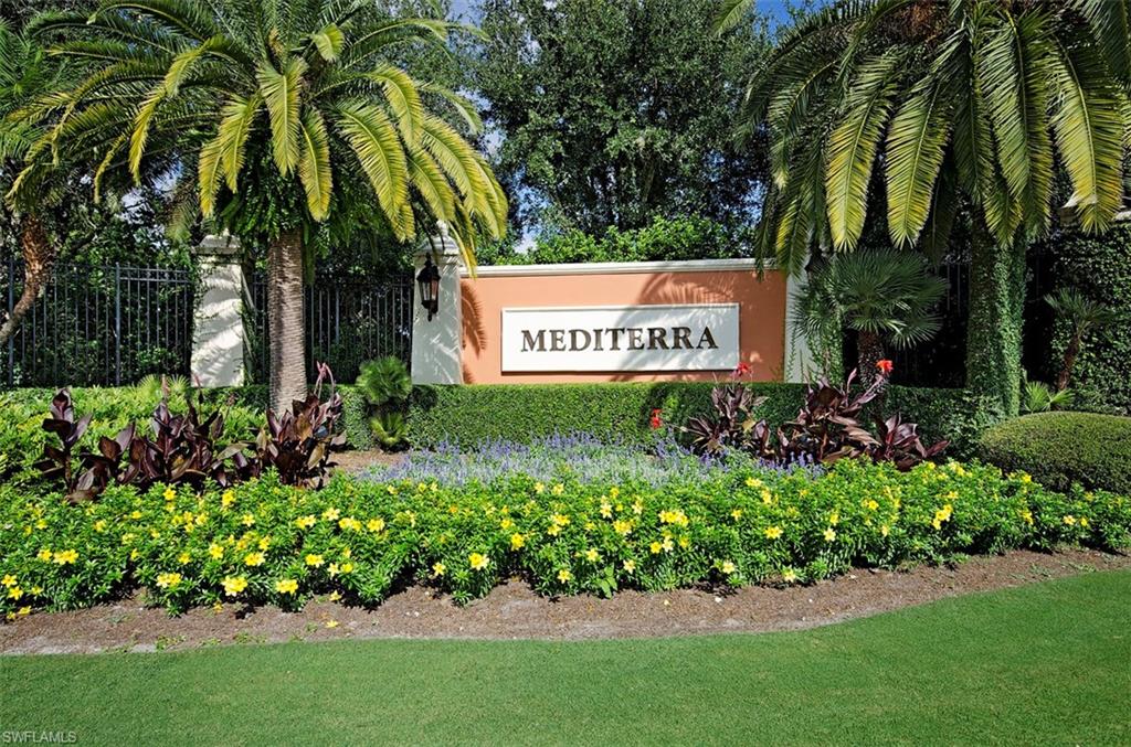 14906 Bellezza Lane Naples, FL 34110 - Photo 22 of 33 a sign that is sitting in front of flowers