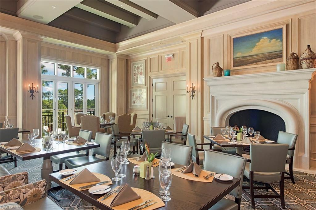 14906 Bellezza Lane Naples, FL 34110 - Photo 23 of 33 a living room with fireplace furniture and a large window