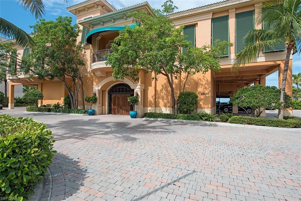 14906 Bellezza Lane Naples, FL 34110 - Photo 30 of 33 a front view of a house with a yard and garage