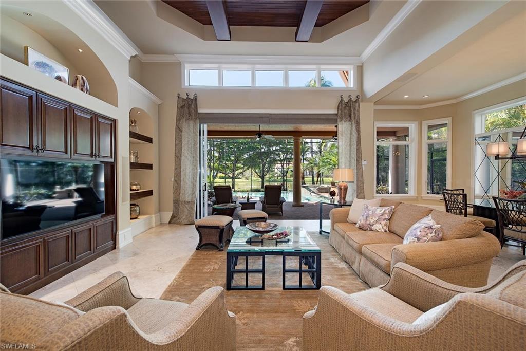 14906 Bellezza Lane Naples, FL 34110 - Photo 8 of 33 a living room with furniture and a large window