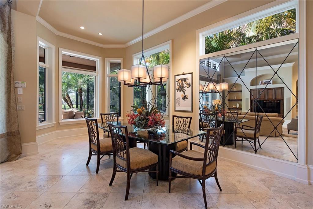 14906 Bellezza Lane Naples, FL 34110 - Photo 10 of 33 a view of a dining room with furniture window and outside view