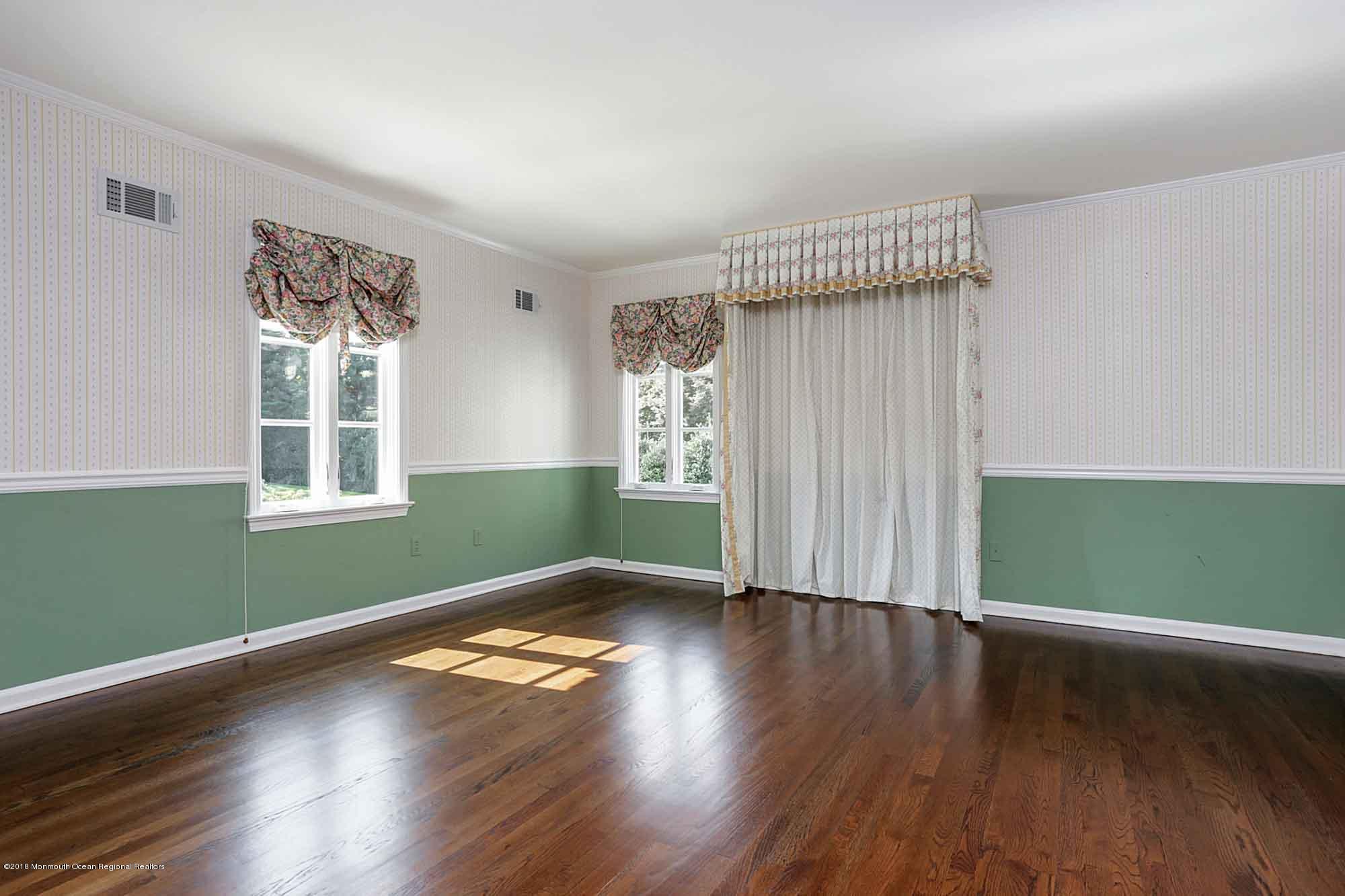 6 Woods End Road Rumson, NJ 07760 - Photo 32 of 43 wooden floor in an empty room with a window