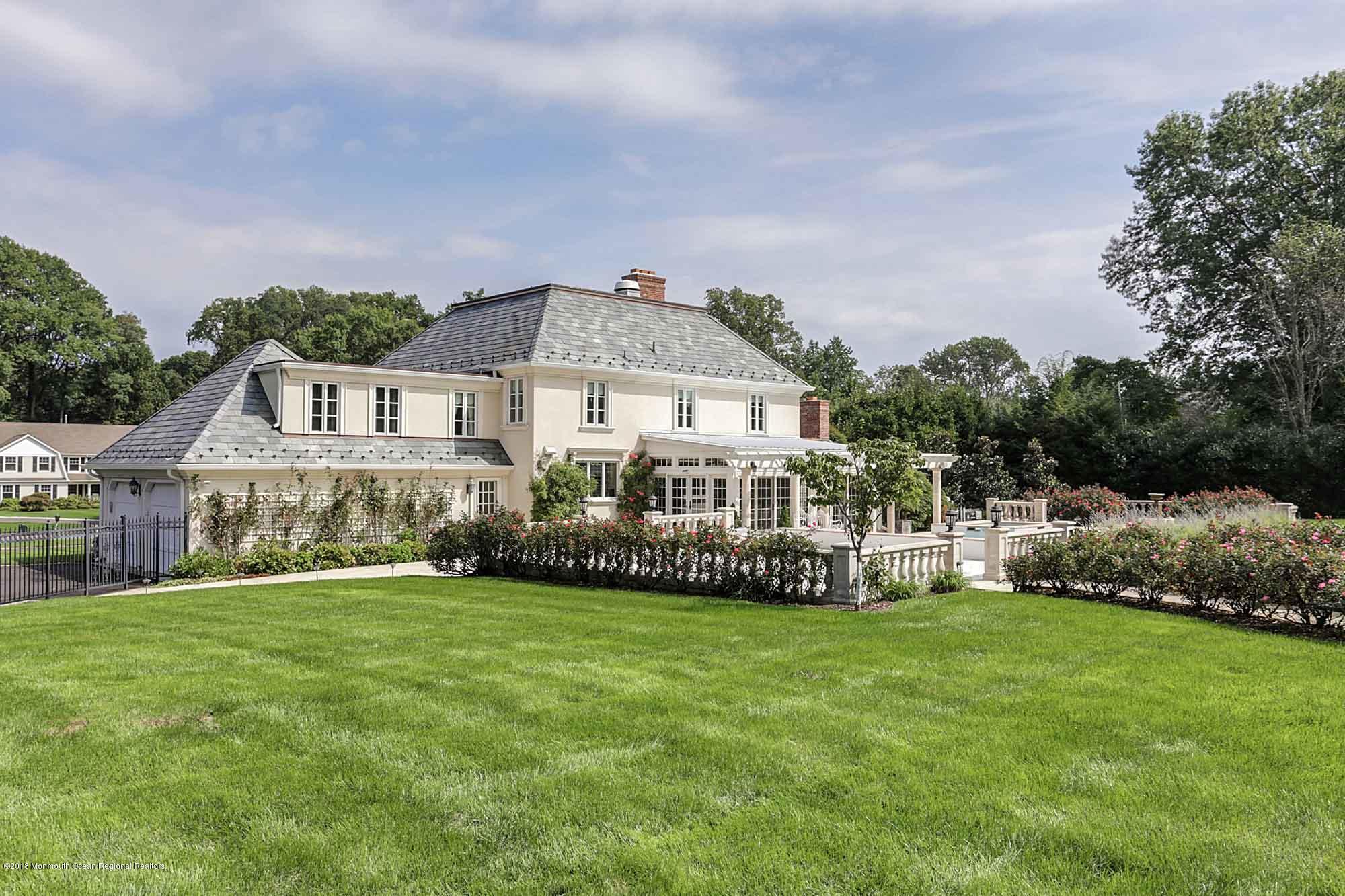 6 Woods End Road Rumson, NJ 07760 - Photo 7 of 43 a front view of house with yard and green space