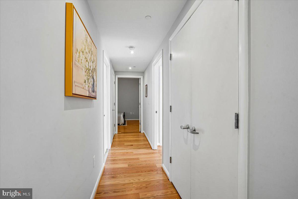350 G Street Southwest, Unit N511 Washington, DC 20024 - Photo 13 of 27 a view of a hallway with wooden floor