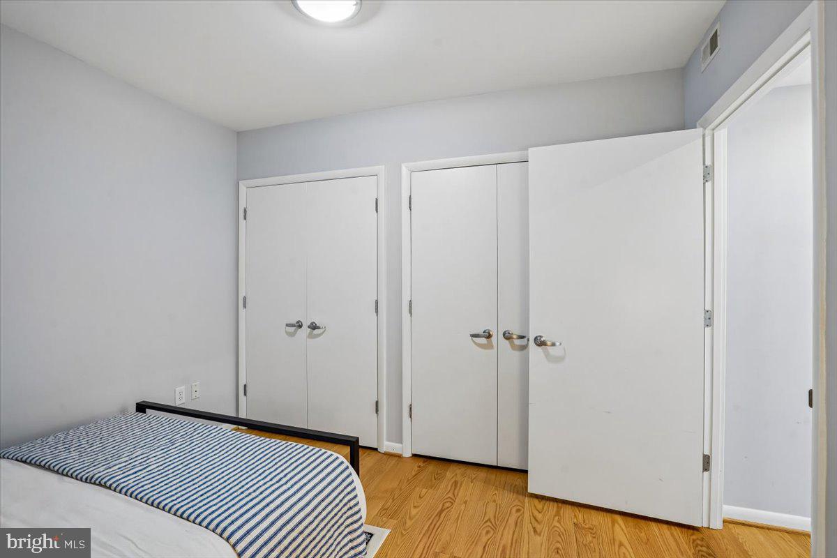 350 G Street Southwest, Unit N511 Washington, DC 20024 - Photo 23 of 27 a view of a bedroom with wooden floor