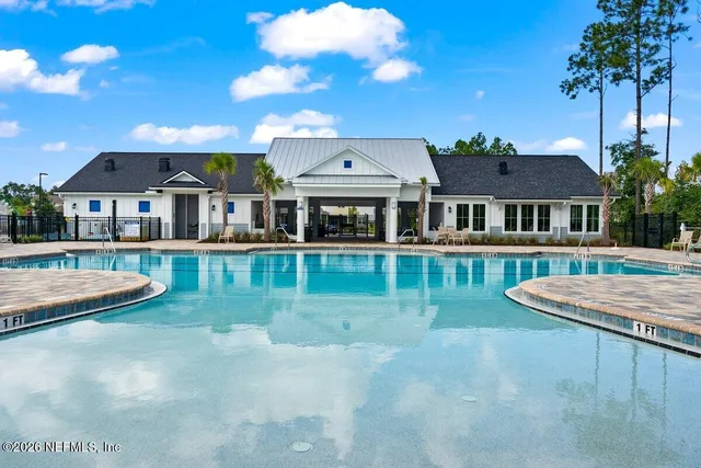 a view of a house with swimming pool