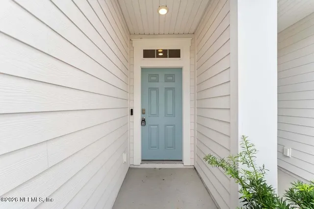 a view of front door and wooden floor