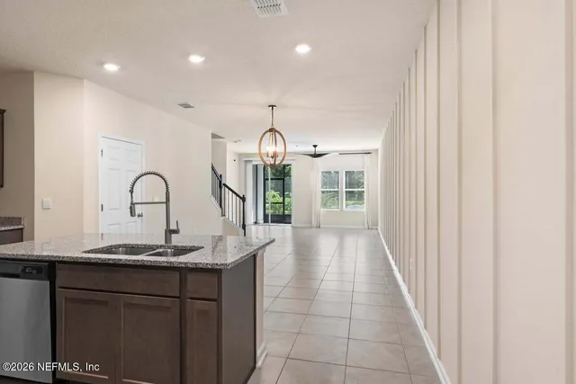 a kitchen with a sink and a window