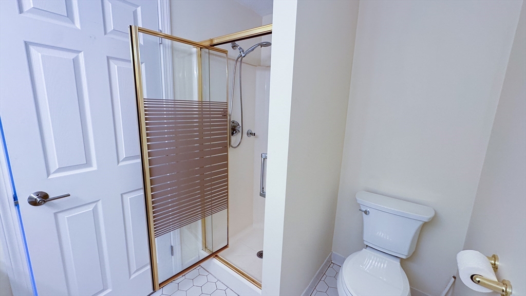 8 Ledgewood Way, Unit 20 Peabody, MA 01960 - Photo 14 of 37 a bathroom with a toilet and a shower