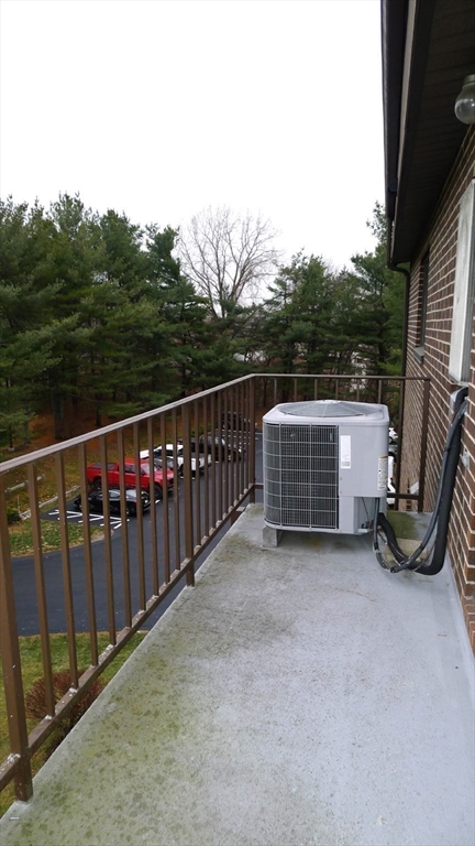 8 Ledgewood Way, Unit 20 Peabody, MA 01960 - Photo 21 of 37 a view of a deck with iron fence