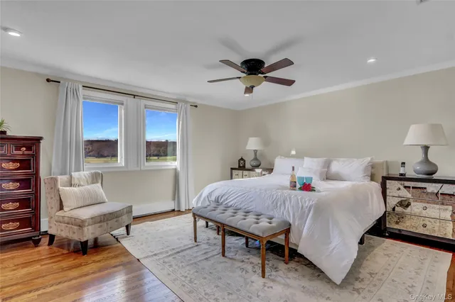 a bedroom with a bed a table and chair